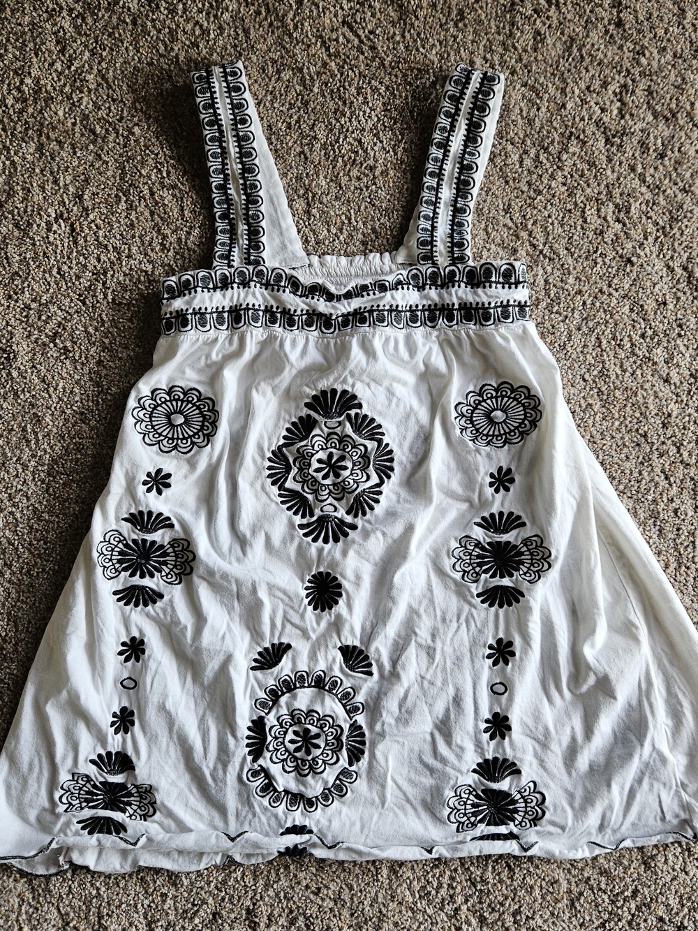 White Top with Black Embroidered Floral Motif